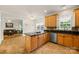 Open kitchen features granite countertops, tile backsplash and stainless steel dishwasher at 220 Glenville Dr, Fort Mill, SC 29715