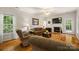 Comfortable living room with a fireplace, hardwood floors, and cozy furniture at 220 Glenville Dr, Fort Mill, SC 29715