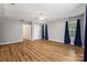 Spacious main bedroom features hardwood floors, neutral walls, a ceiling fan, and two windows at 220 Glenville Dr, Fort Mill, SC 29715
