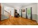 Sunlit home office with hardwood floors, wainscoting, and a view to the staircase and entry at 220 Glenville Dr, Fort Mill, SC 29715