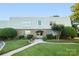 Charming building exterior featuring a well-manicured lawn and lush landscaping, perfect for enjoying the outdoors at 2638 Park Rd # H, Charlotte, NC 28209