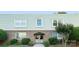 Inviting building with well-maintained landscaping, featuring a brick facade and green accents at 2638 Park Rd # H, Charlotte, NC 28209