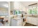 Bright kitchen featuring white cabinets, modern appliances, and granite countertops at 2638 Park Rd # H, Charlotte, NC 28209