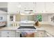 Functional kitchen with white cabinets, granite countertops, and open access to the dining and living areas at 2638 Park Rd # H, Charlotte, NC 28209