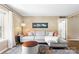 Comfortable living room with stylish rug, neutral walls, and cozy couch at 2638 Park Rd # H, Charlotte, NC 28209