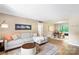 Inviting living room featuring a comfortable couch, a stylish rug, and an open layout at 2638 Park Rd # H, Charlotte, NC 28209