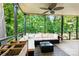 Inviting covered patio featuring outdoor furniture and a view of lush green trees at 2638 Park Rd # H, Charlotte, NC 28209