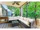 Charming covered patio featuring comfortable seating and a serene view of lush greenery at 2638 Park Rd # H, Charlotte, NC 28209