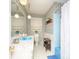 Charming bathroom with bright blue fixtures, patterned wallpaper, and ample natural light at 269 Johnson Dairy Rd, Mooresville, NC 28115