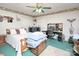 Cozy bedroom with wood furnishings, two windows, ceiling fan, desk area, and unique decor at 269 Johnson Dairy Rd, Mooresville, NC 28115