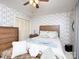 Comfortable bedroom with a full bed, classic wallpaper, and vintage decor with neutral lighting at 269 Johnson Dairy Rd, Mooresville, NC 28115