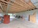 Expansive garage interior with concrete floor, cinder block walls, and exposed rafters, ideal for storage and projects at 269 Johnson Dairy Rd, Mooresville, NC 28115