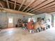 Garage interior with concrete flooring, cinder block walls, with an array of tools and storage solutions at 269 Johnson Dairy Rd, Mooresville, NC 28115