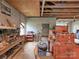 Organized garage workshop featuring a sturdy workbench, multiple toolboxes, and exposed wooden beams at 269 Johnson Dairy Rd, Mooresville, NC 28115