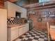 Functional kitchen with white cabinetry and checkered flooring, ready for your culinary adventures at 269 Johnson Dairy Rd, Mooresville, NC 28115
