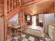 Rustic living room featuring wood paneling, hardwood floors, and a staircase, creating a cozy and vintage ambiance at 269 Johnson Dairy Rd, Mooresville, NC 28115