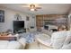 Inviting living room with comfortable seating, brick fireplace, built-in shelving, and abundant decor at 269 Johnson Dairy Rd, Mooresville, NC 28115