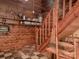 Rustic interior with wood paneling, a staircase, and a tiled floor, exuding a warm and inviting atmosphere at 269 Johnson Dairy Rd, Mooresville, NC 28115