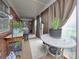 Bright sunroom featuring brick walls, potted plants, neutral carpeting and ample natural light at 269 Johnson Dairy Rd, Mooresville, NC 28115