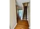 Inviting entryway showcasing hardwood floors and a carpeted staircase leading to the upper level at 303 Eastwood Dr, Salisbury, NC 28146