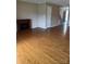 Open living area boasts hardwood floors and an electric fireplace at 303 Eastwood Dr, Salisbury, NC 28146