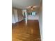 Open-concept living room featuring hardwood floors, ample natural light, and neutral paint at 303 Eastwood Dr, Salisbury, NC 28146