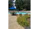 Community pool featuring surrounding lounge chairs, tables and beautiful landscaping at 303 Eastwood Dr, Salisbury, NC 28146