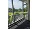 Screened-in porch offers serene views of the lush green lawn at 303 Eastwood Dr, Salisbury, NC 28146