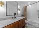 Bathroom with a tiled shower, vanity with marble top, and stylish modern fixtures at 304 Keswick Ave, Charlotte, NC 28206