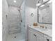 Modern bathroom featuring a tiled shower, marble countertop, and stylish fixtures, offering a spa-like experience at 304 Keswick Ave, Charlotte, NC 28206