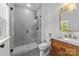 Modern bathroom featuring a glass shower, stylish vanity, and patterned tile flooring at 304 Keswick Ave, Charlotte, NC 28206