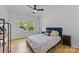 Cozy bedroom with natural light, hardwood floors, and minimalist modern decor at 304 Keswick Ave, Charlotte, NC 28206