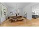 Inviting dining area with hardwood floors, a chandelier, and a view into the modern kitchen at 304 Keswick Ave, Charlotte, NC 28206