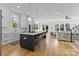 Spacious kitchen with large island, bar seating, modern finishes, and open to the living area at 304 Keswick Ave, Charlotte, NC 28206