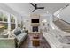 Spacious living room features a fireplace, large windows, hardwood floors, and staircase at 304 Keswick Ave, Charlotte, NC 28206