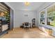 Bright home office with hardwood floors, a large window, and minimalist decor, offering a serene workspace at 304 Keswick Ave, Charlotte, NC 28206
