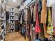 Spacious walk-in closet featuring built-in shelving and ample hanging space at 304 Keswick Ave, Charlotte, NC 28206