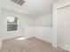 Upstairs bonus room with neutral carpet and a large window, bathed in natural light at 312 Adams St, Salisbury, NC 28144