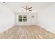 Inviting living room featuring wood floors, large window and glass panel door at 312 Adams St, Salisbury, NC 28144