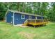 Rear exterior of house featuring deck with railings, perfect for outdoor relaxation at 327 Holly Dr, Mount Holly, NC 28120
