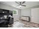 Bedroom featuring gray walls, ceiling fan, and a dresser with stylish pulls at 327 Holly Dr, Mount Holly, NC 28120