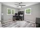 Bedroom featuring gray walls, ceiling fan, and a dedicated workspace at 327 Holly Dr, Mount Holly, NC 28120