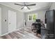 Bedroom with gray walls, ceiling fan, and hardwood-style flooring at 327 Holly Dr, Mount Holly, NC 28120