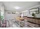 The dining area features neutral walls, wood-look floors, and a dining table at 327 Holly Dr, Mount Holly, NC 28120