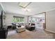 The carpeted living room offers comfortable seating with easy access to the dining room at 327 Holly Dr, Mount Holly, NC 28120