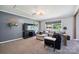 This cozy living room offers comfortable seating and a large TV at 327 Holly Dr, Mount Holly, NC 28120