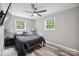 Bedroom featuring gray walls, ceiling fan, and hardwood-style flooring at 327 Holly Dr, Mount Holly, NC 28120