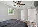 Bedroom featuring gray walls, ceiling fan, and hardwood-style flooring at 327 Holly Dr, Mount Holly, NC 28120