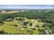 Aerial view highlighting the property within a lush, tree-filled neighborhood at 338 Hickory Grove Rd, Harmony, NC 28634