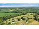 Beautiful aerial view showcases the property nestled in a verdant landscape at 338 Hickory Grove Rd, Harmony, NC 28634